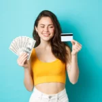 cash and card in hands of a woman